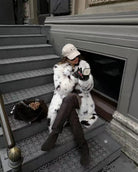 Cozy faux fur long coat with white black speckled hood by Mackage fashion