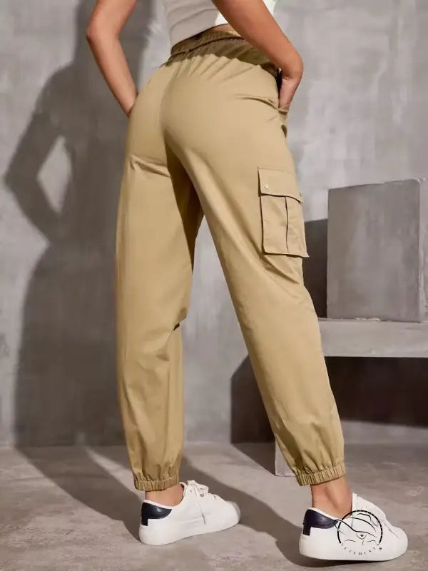 High waist wide leg beige cargo pants with elastic cuffs and white sneakers