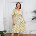 Boho lace floral dress with white V-neck, tie waist, and short sleeves