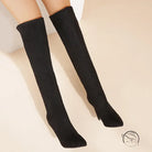 Black stiletto-heeled over-the-knee boots in langry fashion