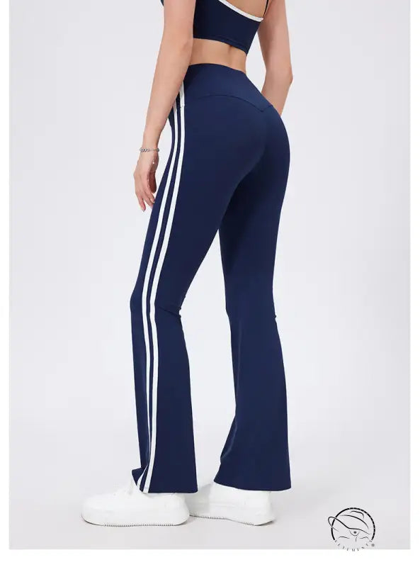 Navy blue high waist yoga pants with white stripes and peach hip raise