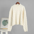 Cream cable knit sweater on wooden hanger, Langry winter fashion ملابس