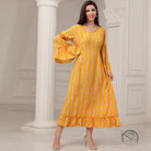 Elegant casual bell sleeve dress in vibrant yellow with pink paisley