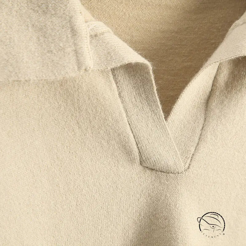 Close-up of beige Langry V-neck knit polo sweater in fashion ملابس