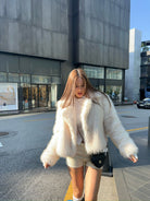 Cream faux fur jacket with black trim, white collar, oversized Langry fashion design