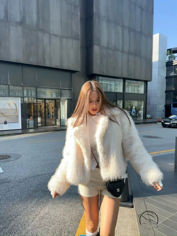 Langry short loose faux fur coat with cream jacket, black trim, white collar