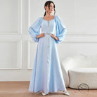 Elegant high waist langry fashion dress in light blue satin with puff sleeves and beaded waistband