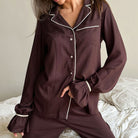 Langry brown satin pajama set with white piping and ruffled cuffs