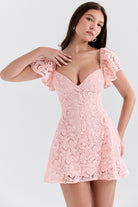 Pink lace mini dress with puff sleeves and sweetheart neckline, perfect for elegant fashion