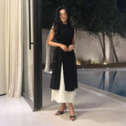 Langry fashion ملابس: black and white sleeveless retro dress with ruffled hem