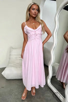 Elegant loose dress: light pink midi sundress with spaghetti straps