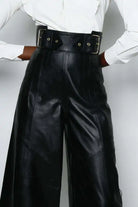 Faux leather bell bottom pants with high waist and double-buckle belt