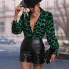 Green leopard print langry fashion blouse with puff sleeves and black leather shorts