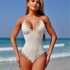 White ribbed one-piece swimsuit with decorative trim from Stunning Matching Sling Swimwear