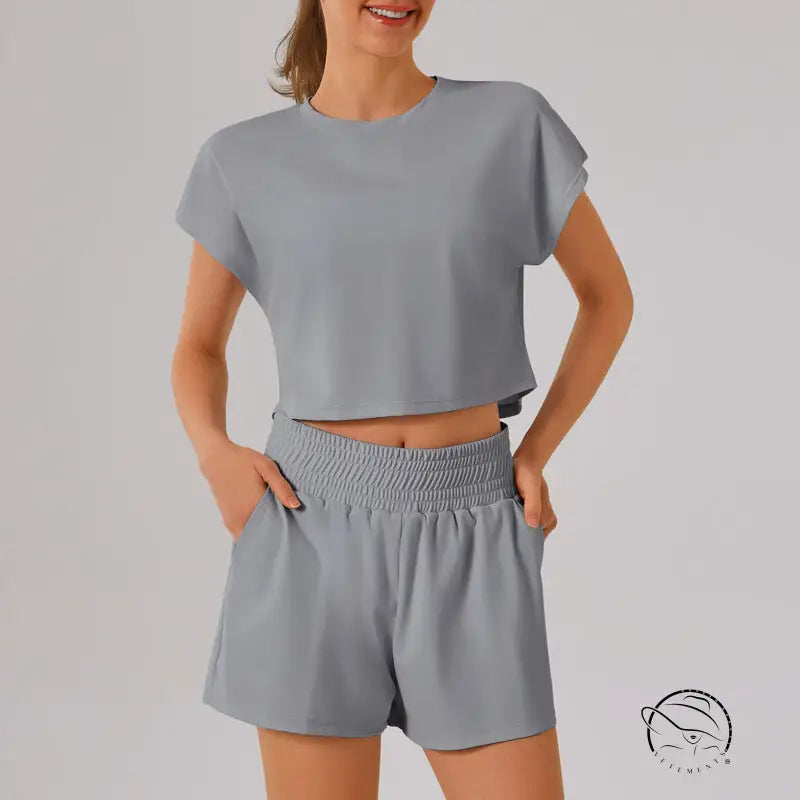Light gray loose sports yoga fitness set with crop top and shorts