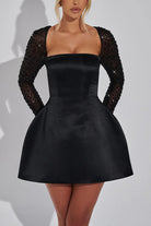 Black satin mini dress with beaded sleeves from Langry’s fashion collection ملابس