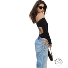 Woman in off-shoulder black top and sexy chain straight jeans