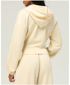 Cream-colored hooded sweatshirt and matching pants from Langry fashion ملابس collection