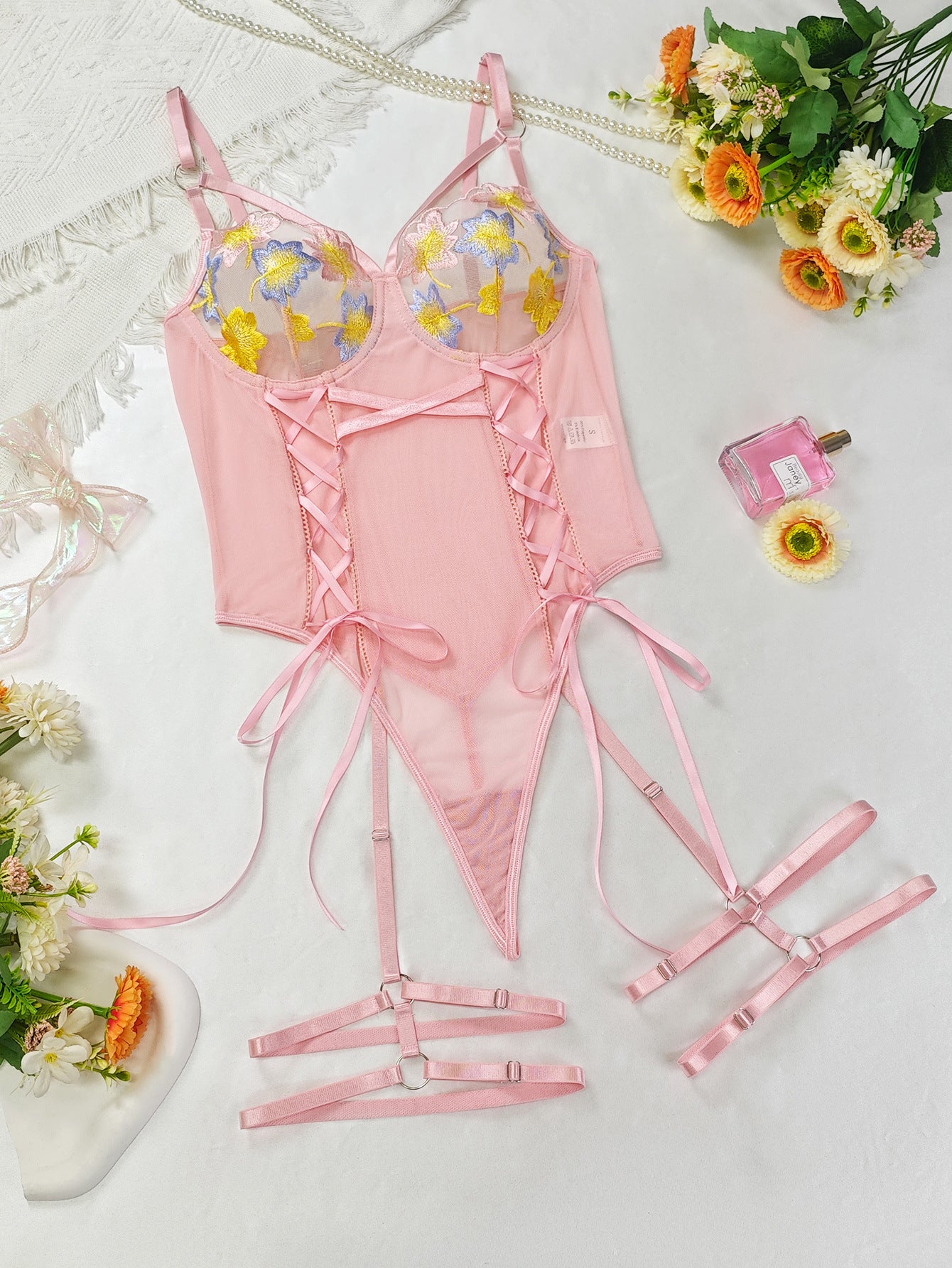 Pink embroidery lingerie set with floral lace accents and adjustable straps for fashion