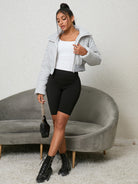 Woman in a stylish Cozy Cotton Padded Jacket showcasing modern langry fashion ملابس