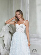 Elegant white fairy dress with corset straps and large swing tulle