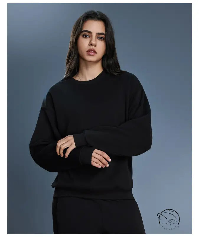 Black long sleeve oversized cotton blend hoodie with ribbed cuffs