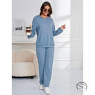 Woman in blue ribbed hooded casual suit pajamas set