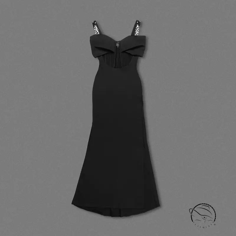 Elegant black maxi dress with spaghetti straps, bow bodice, and rhinestone details