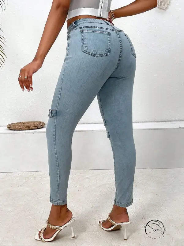 Light blue high elastic skinny jeans with buckle details