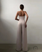 Elegant white modern jumpsuit with fitted bodice and open back