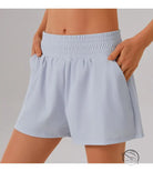 Light blue elastic-waist shorts with pockets in loose sports yoga fitness set