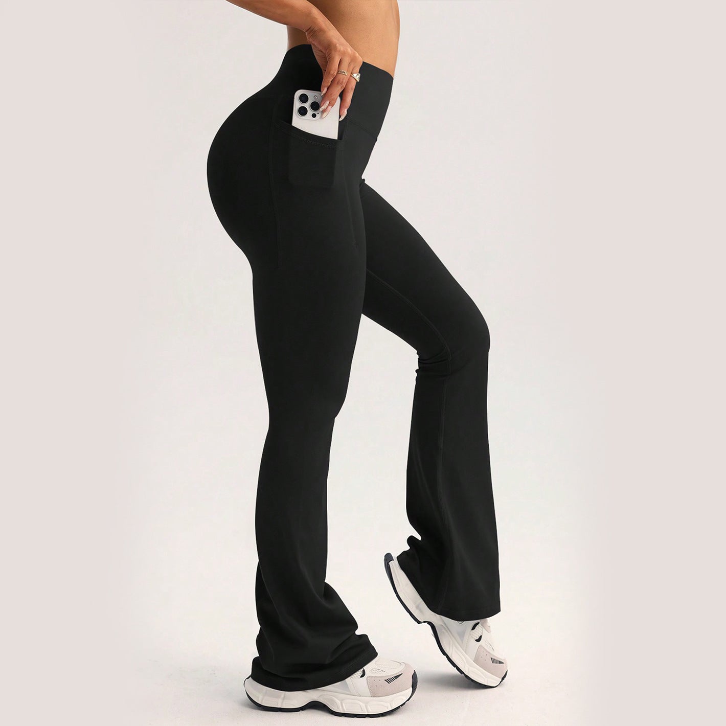 Black high-waisted flare yoga pants with side pocket in langry fashion ملابس
