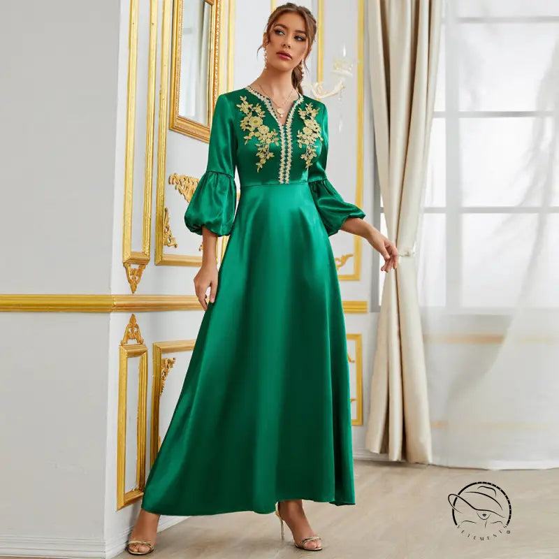 Emerald green langry satin gown with gold embroidery and bell sleeves