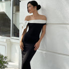 Elegant black and white off-shoulder evening gown by Langry, ideal for fashion events