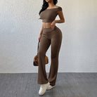 Langry fashion brown two-piece workout set with off-shoulder crop top and flared pants