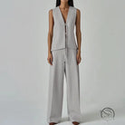 Sleek light gray long sleeve fashion vest with deep v-neck and tie detail