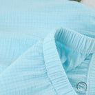 Light blue quilted langry pajamas in cotton crepe with ruffled edge