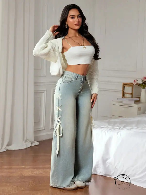 Light-wash wide leg denim pants with white lace-up side ties, casual fashion