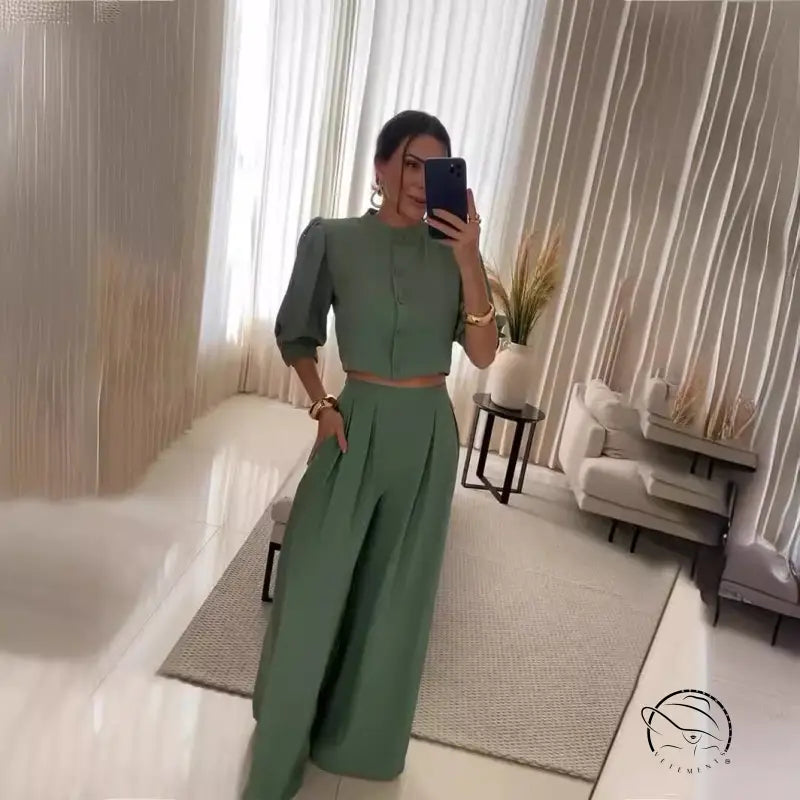 Woman in green summer striped half sleeve top trousers suit