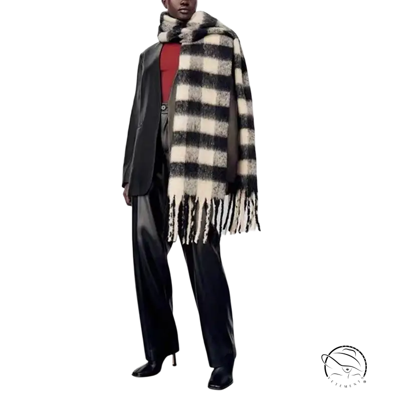 Stylish outfit with a black white wool scarf, dark suit, and red top for fashion enthusiasts