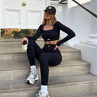 Woman in black athletic wear and NY Yankees cap showcasing AOMR skinny leggings set
