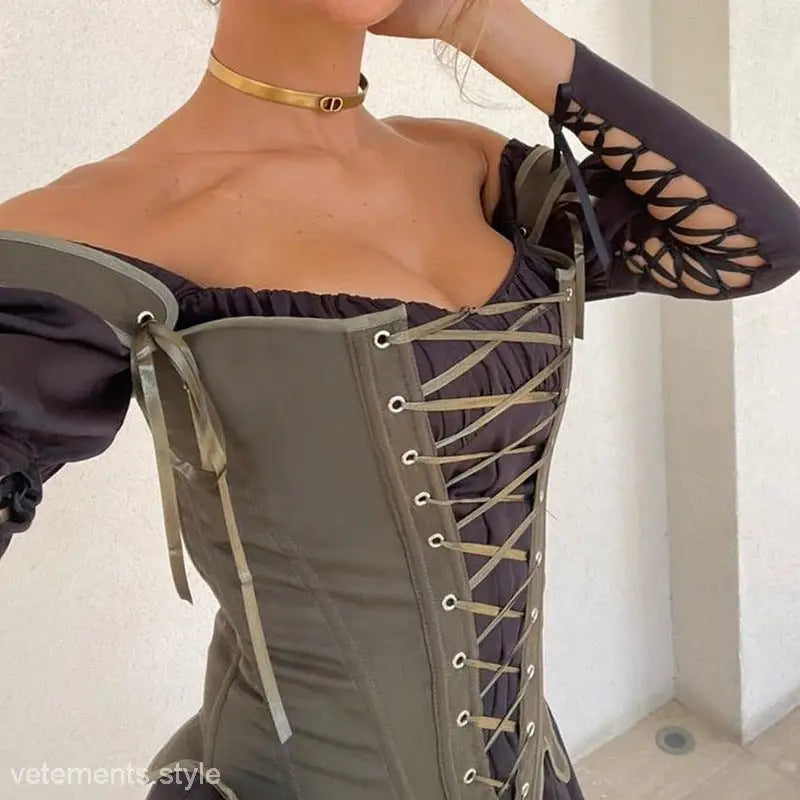 Woman wearing army green cowgirl boning corset with waist slim fit and black off-the-shoulder top