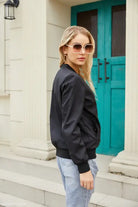 Blonde woman in jeans and sunglasses near turquoise door wearing Army Green Casual Varsity Jacket