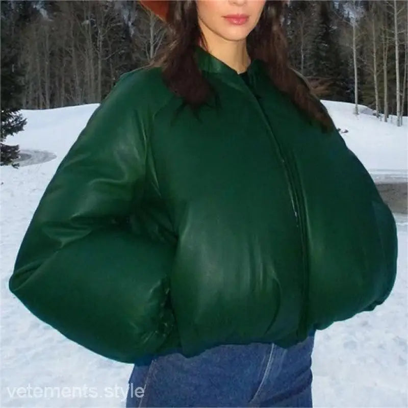 Woman in army green cotton cozy jacket with zipper and pockets in snowy outdoor setting