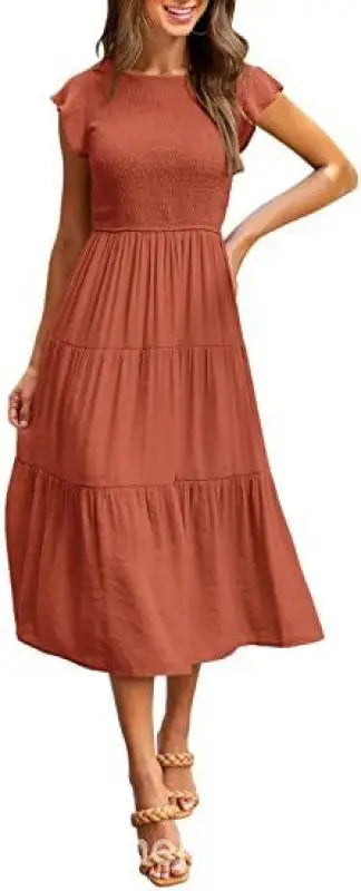 Rust-colored tiered midi dress with flounced large swing design and army green details