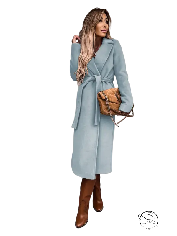 Woman in army green polo collar long sleeved top with belted woolen coat