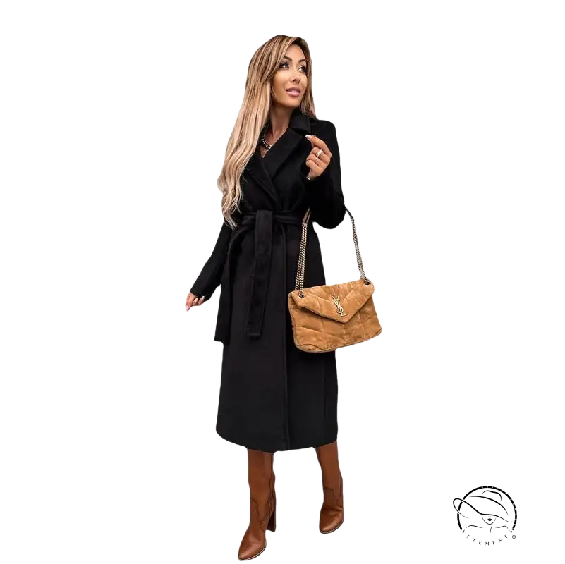 Woman in army green polo collar long sleeved top with belted black coat