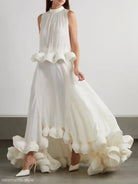 Elegant white sleeveless gown featuring asymmetric patchwork ruffled details in a two piece suit