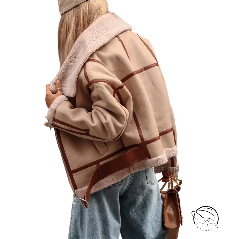Beige and brown plaid shearling-lined coat locomotive jacket over blue jeans for autumn winter