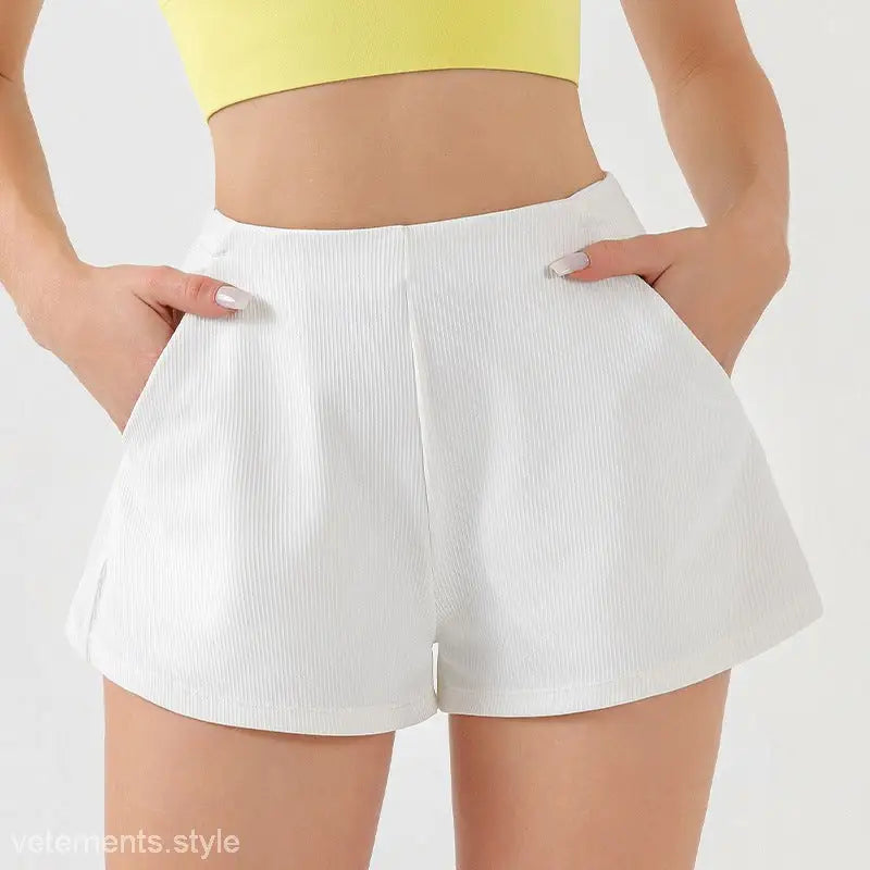 White high-waisted shorts with pockets, ideal as comfy high waist yoga shorts for style